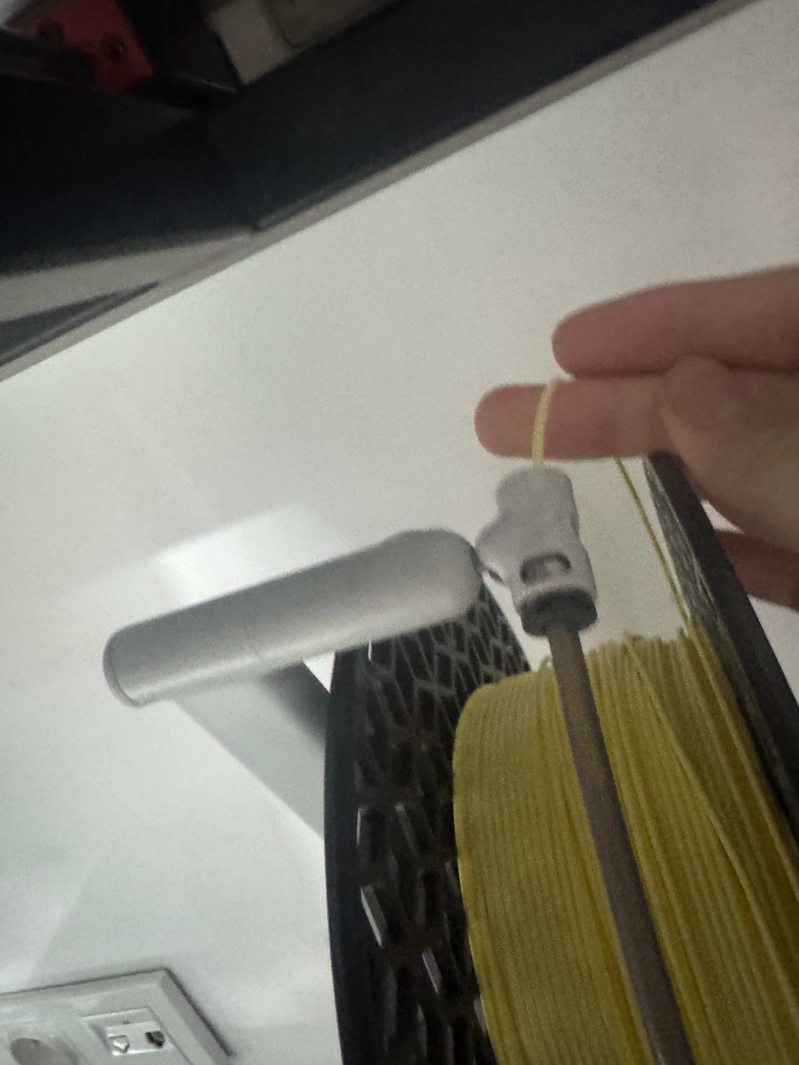 Feeding filament through the tube