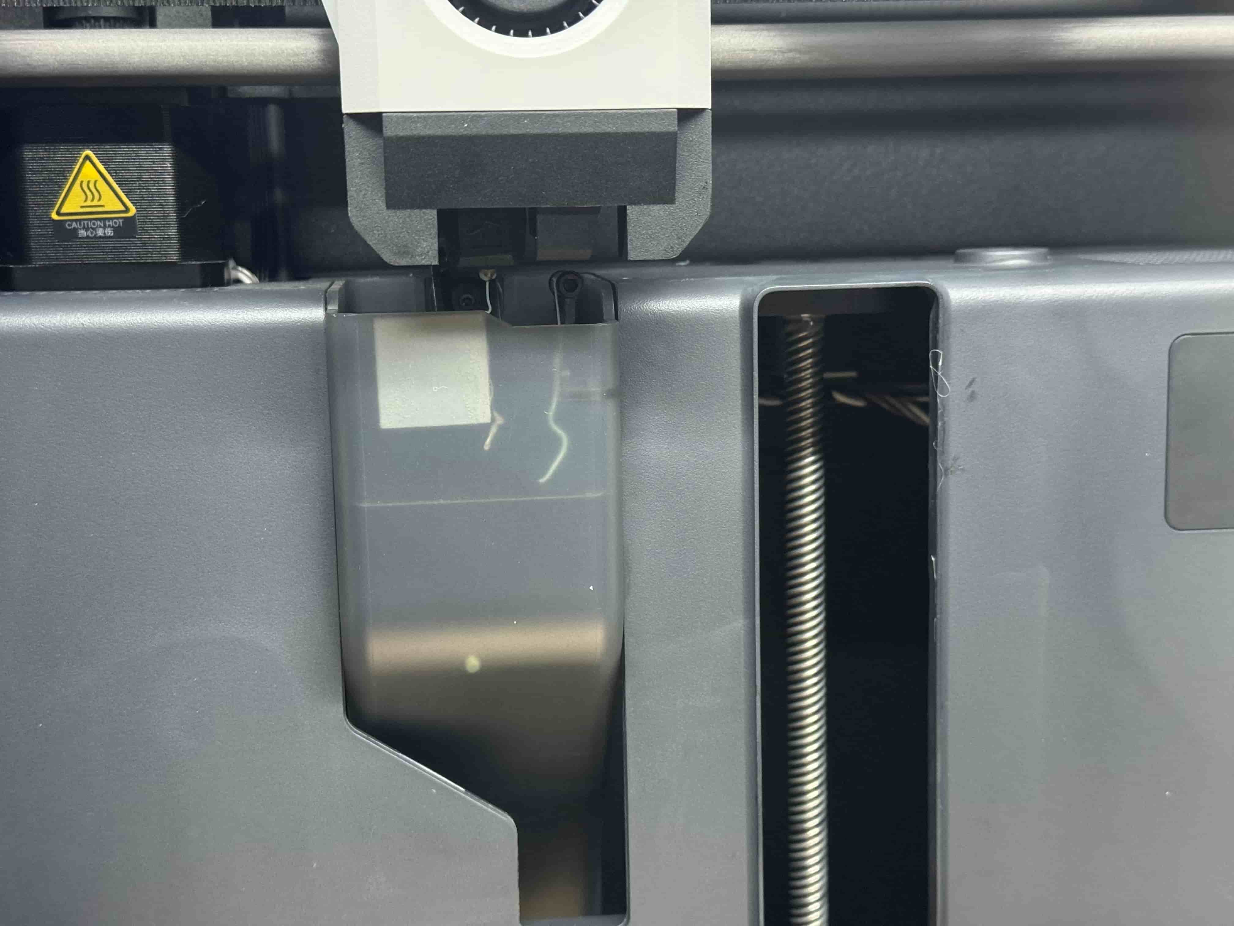 Filament extruding from nozzle